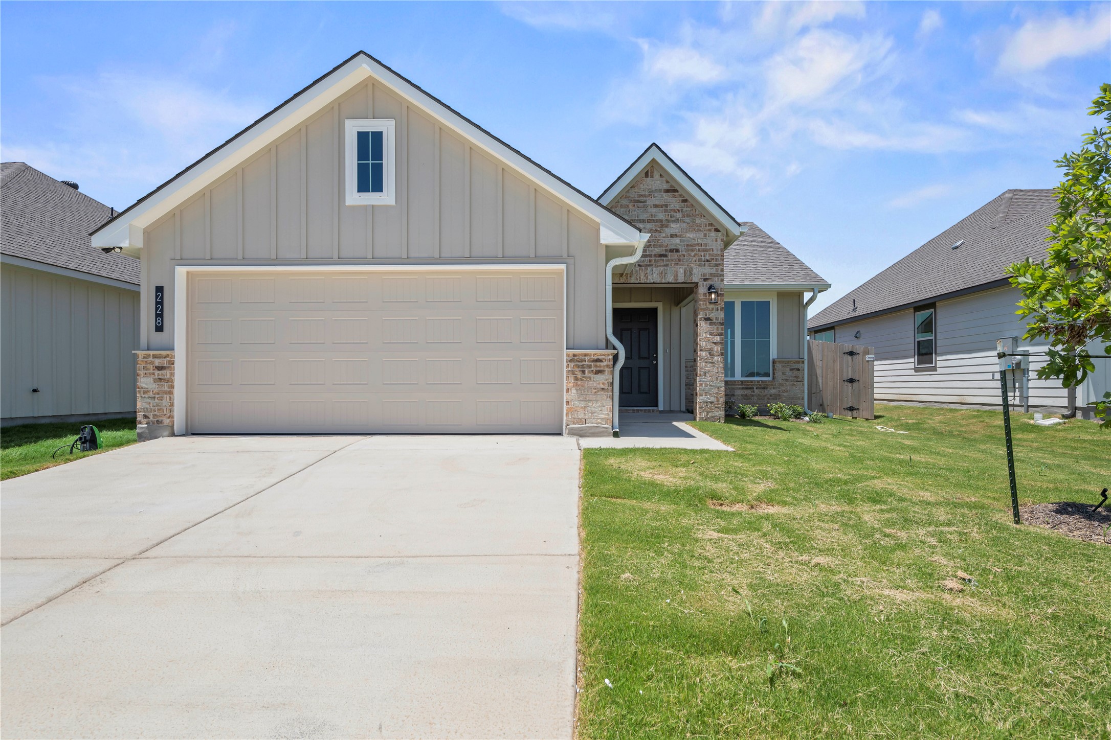 228 Gus Loop Georgetown, TX 78626 - Photo 1 of 19 A welcoming facade showcases a single-car garage, neatly maintained lawn, and attractive mixed-material construction.