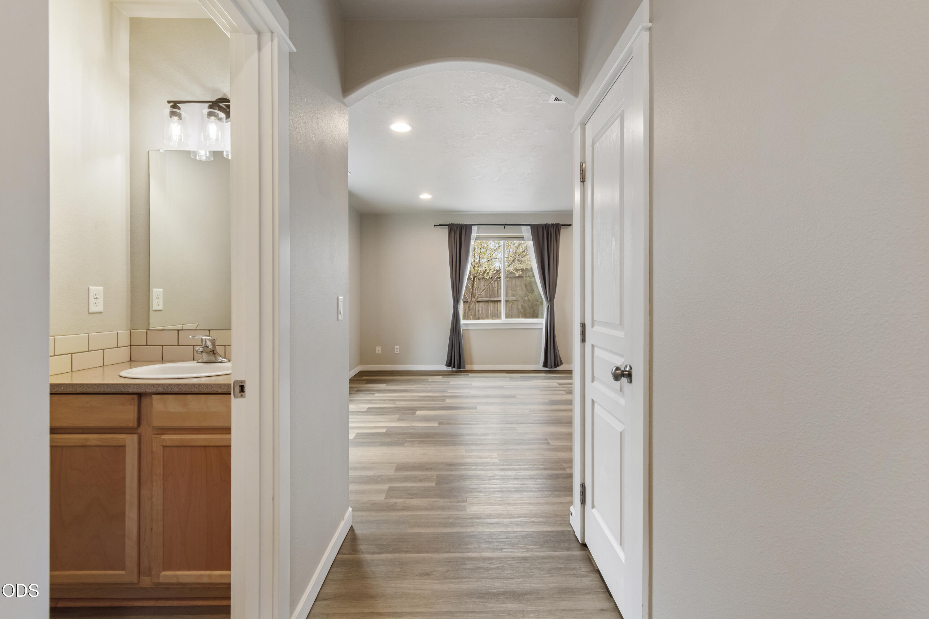 21332 Oconnor Way Bend, OR 97701 - Photo 17 of 33 a view of a hallway with wooden floor and staircase