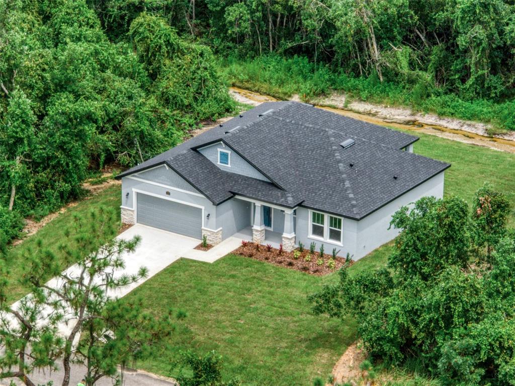 front view of a house with a yard