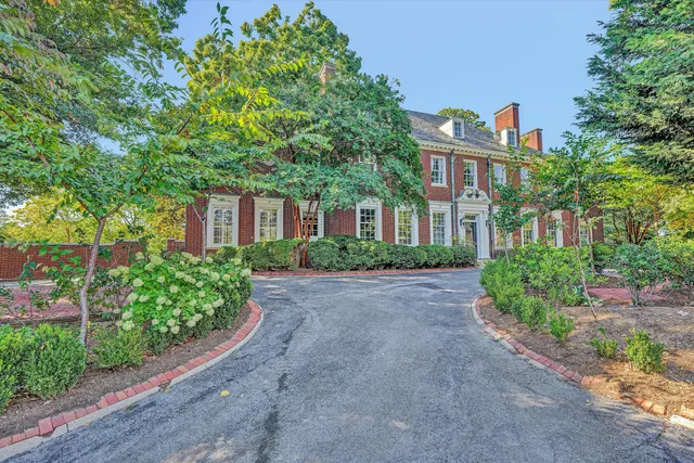 a view of a brick building with many windows
