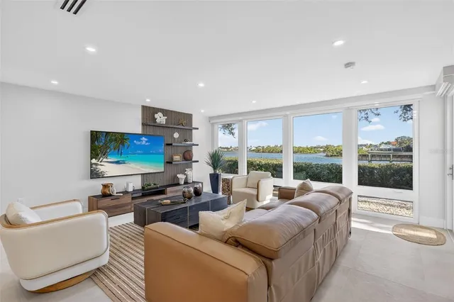 a view of swimming pool with sitting area and garden