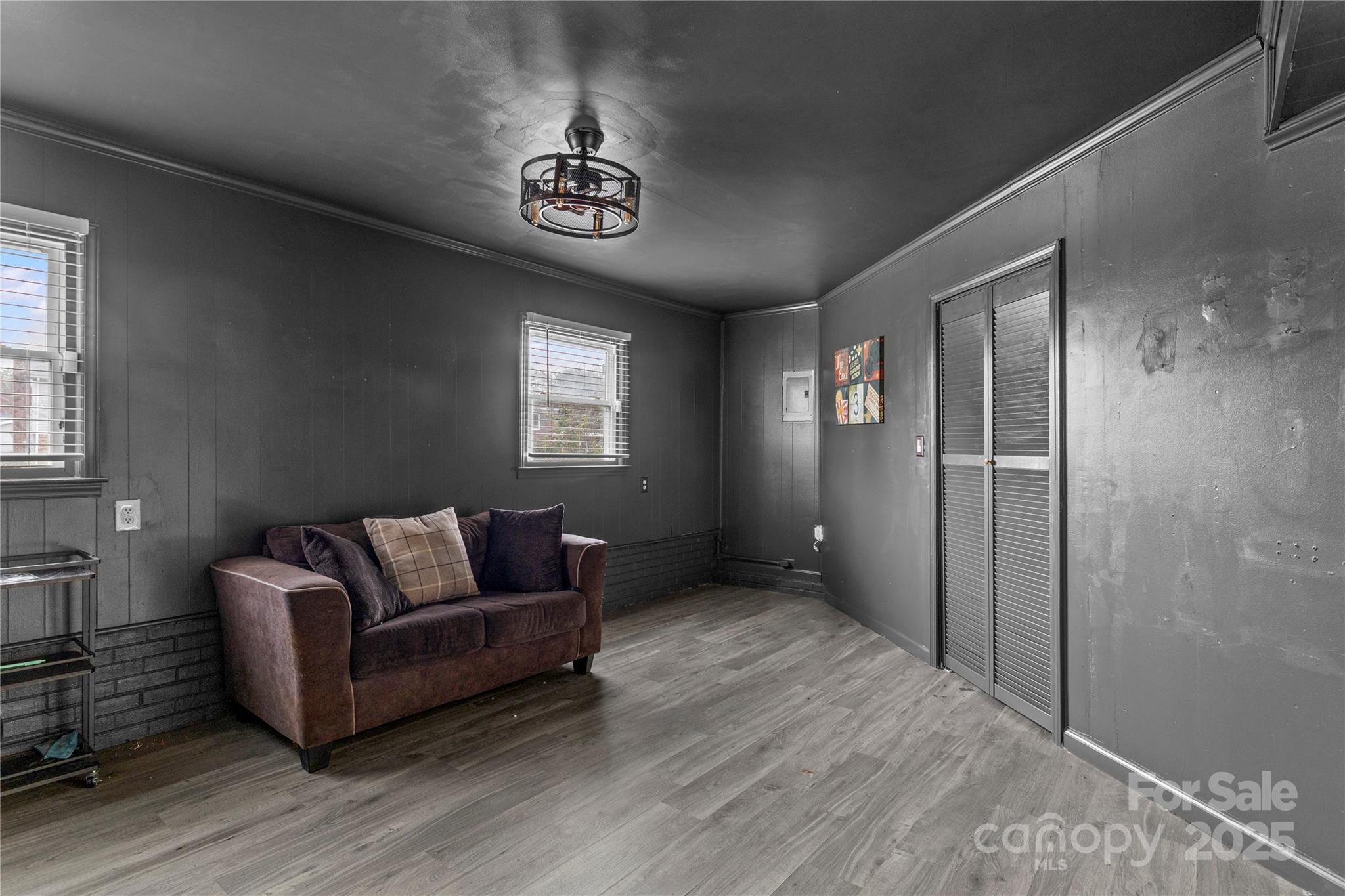 102 Wingate Drive Stanley, NC 28164 - Photo 21 of 37 a living room with furniture and a chandelier