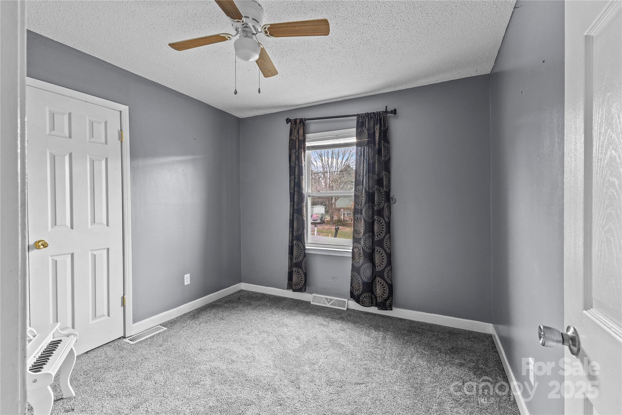 102 Wingate Drive Stanley, NC 28164 - Photo 28 of 37 an empty room with windows and fan