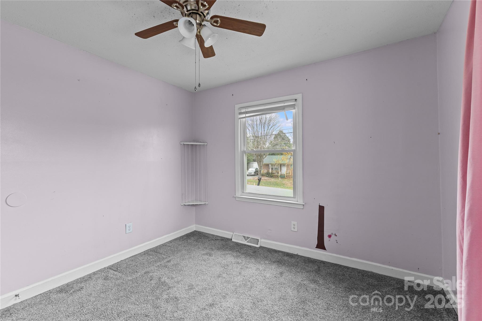 102 Wingate Drive Stanley, NC 28164 - Photo 29 of 37 an empty room with a window and a fan