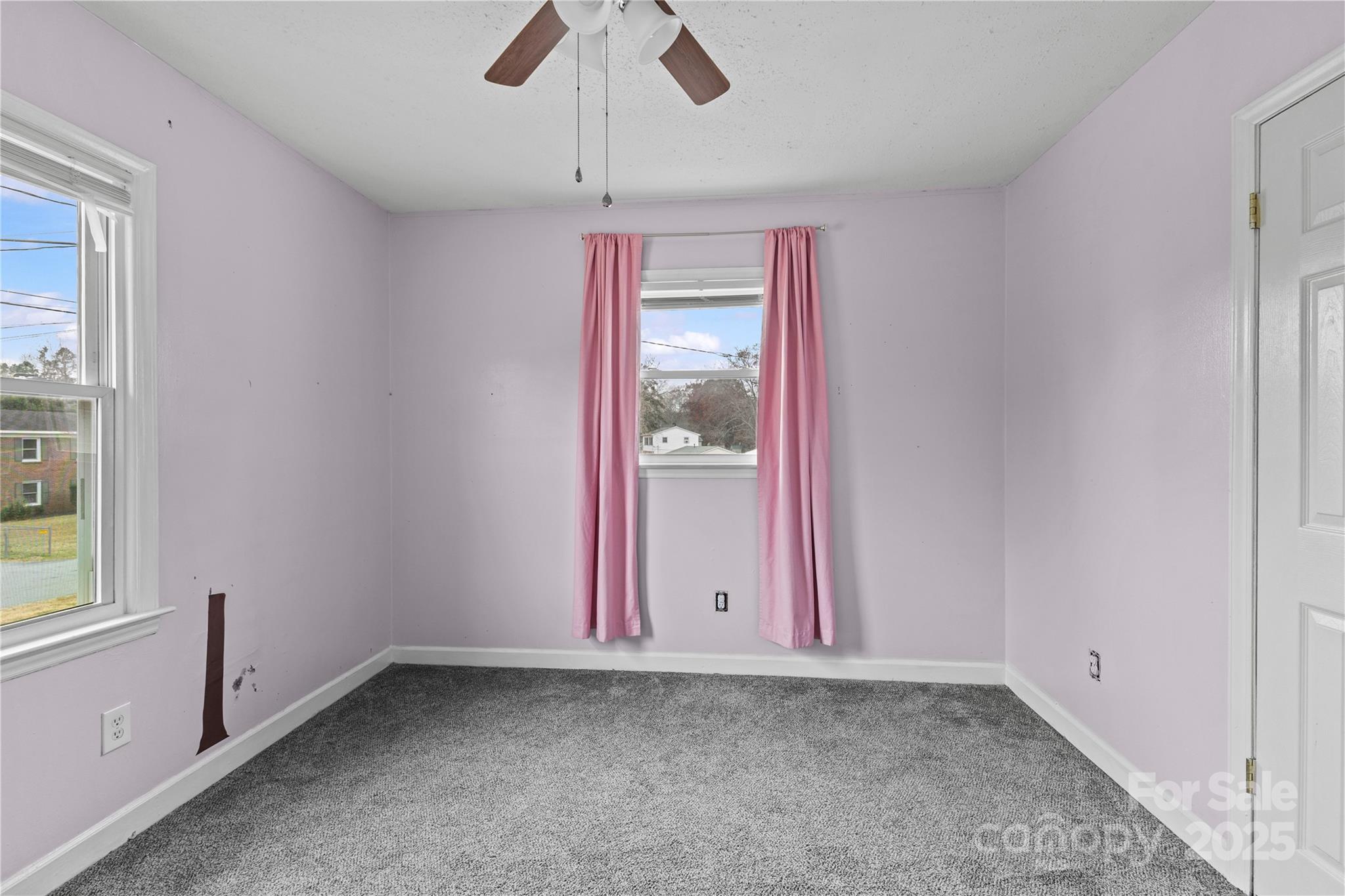 102 Wingate Drive Stanley, NC 28164 - Photo 30 of 37 an empty room with chandelier fan and windows