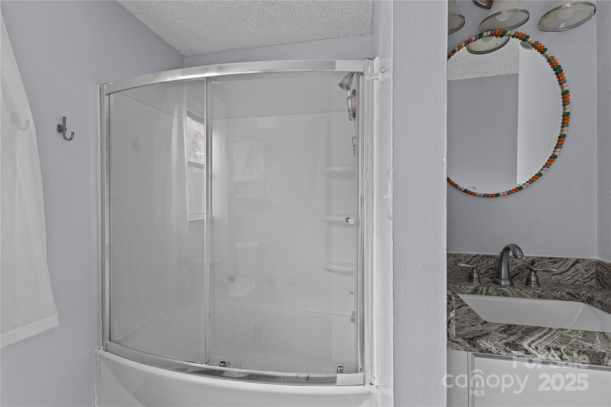 102 Wingate Drive Stanley, NC 28164 - Photo 35 of 37 a bathroom with a granite countertop shower and a mirror