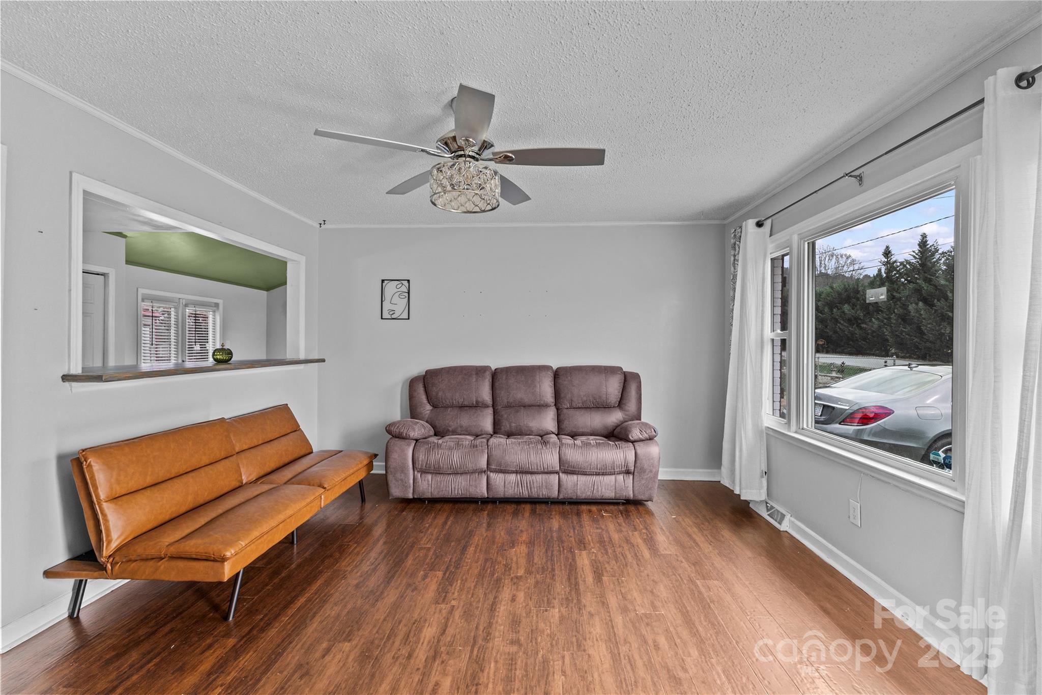 102 Wingate Drive Stanley, NC 28164 - Photo 7 of 37 a living room with furniture a ceiling fan and a rug