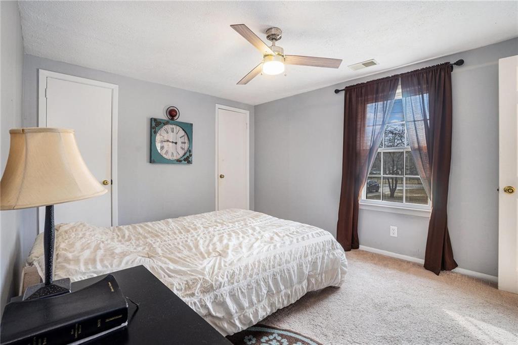 4034 Beaver Road Southwest Loganville, GA 30052 - Photo 14 of 24 a bedroom with a large bed and a window