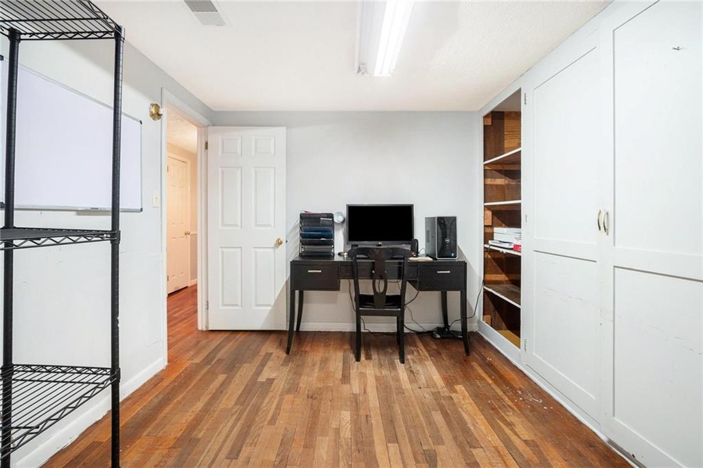 4034 Beaver Road Southwest Loganville, GA 30052 - Photo 19 of 24 a view of a livingroom with furniture and a flat screen tv