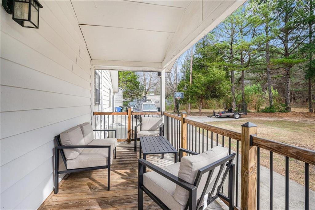 4034 Beaver Road Southwest Loganville, GA 30052 - Photo 22 of 24 a view of two chairs in the balcony