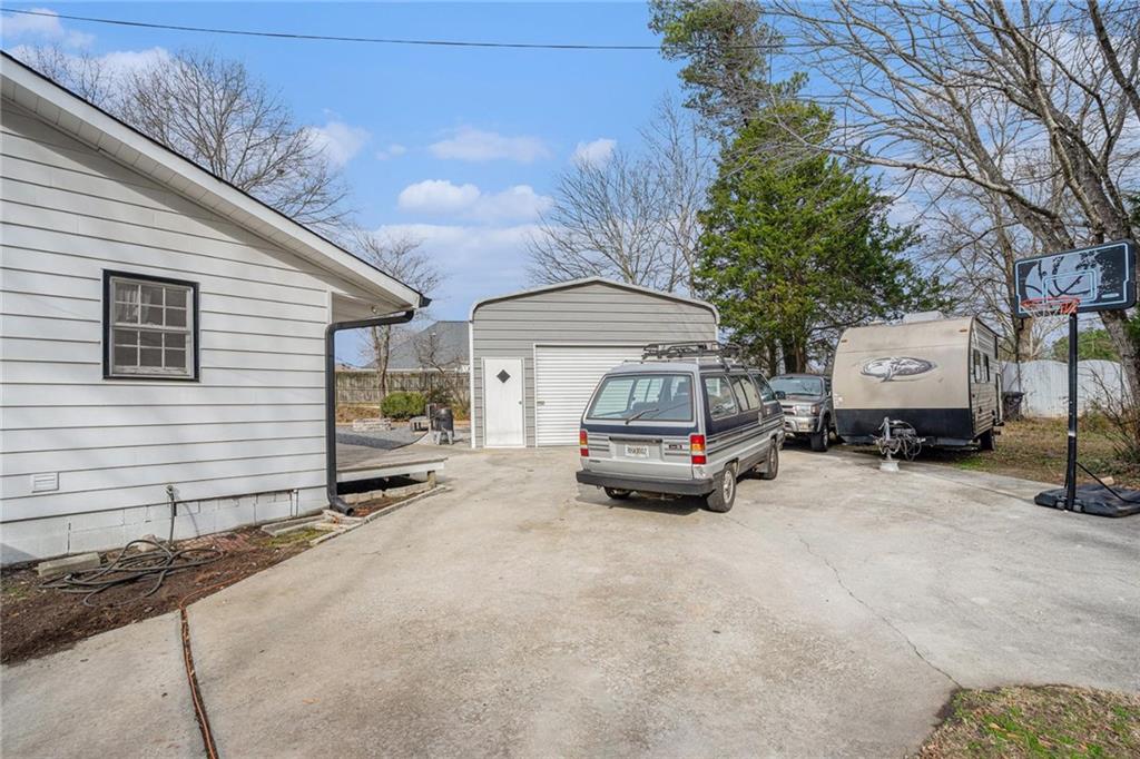 4034 Beaver Road Southwest Loganville, GA 30052 - Photo 24 of 24 a car parked in front of house