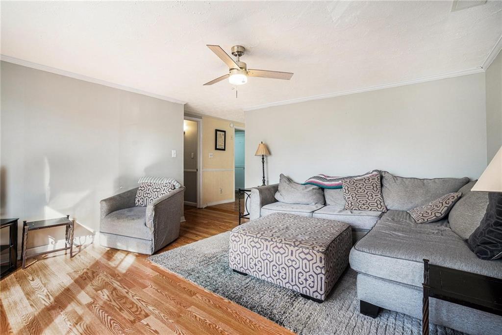4034 Beaver Road Southwest Loganville, GA 30052 - Photo 10 of 24 a living room with furniture and a rug