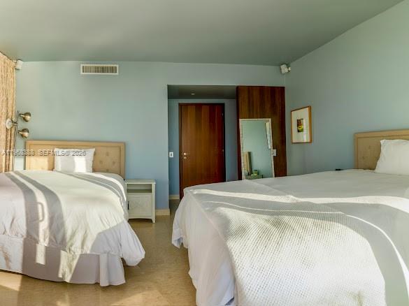 450 Alton Road, Unit 1202 Miami Beach, FL 33139 - Photo 24 of 68 a bedroom with double bed and a window
