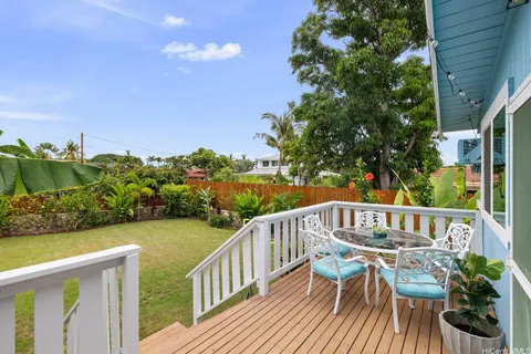 a view of balcony with furniture and garden