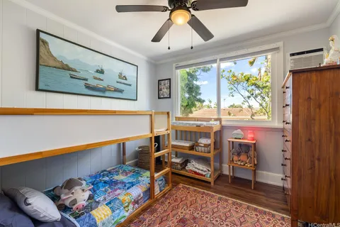 a bedroom with furniture and a window