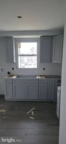 a room with wooden cabinets and window
