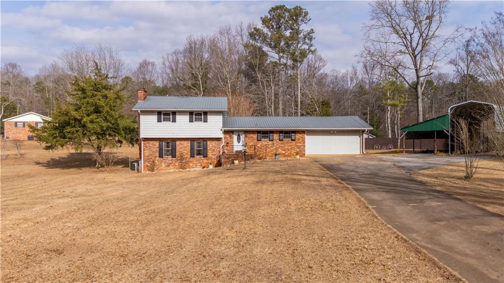 3318 Springdale Forrest Circle Gainesville, GA 30506 - Photo 1 of 1 a view of a house with snow on the road