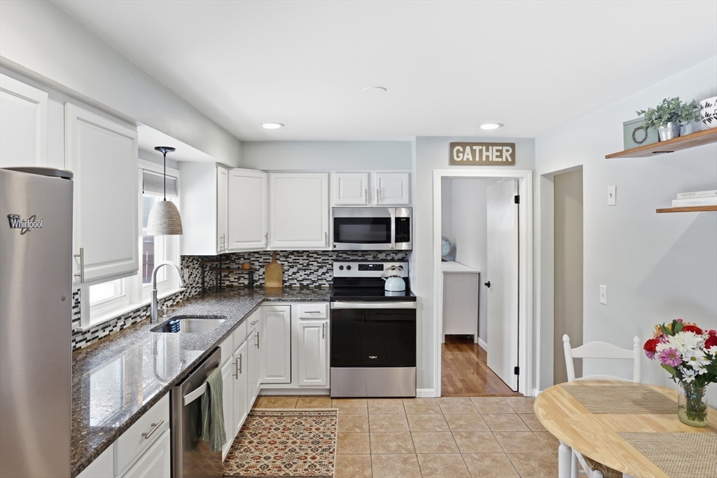 37 Sterling Street Lancaster, MA 01523 - Photo 11 of 33 a kitchen with stainless steel appliances a stove sink and refrigerator