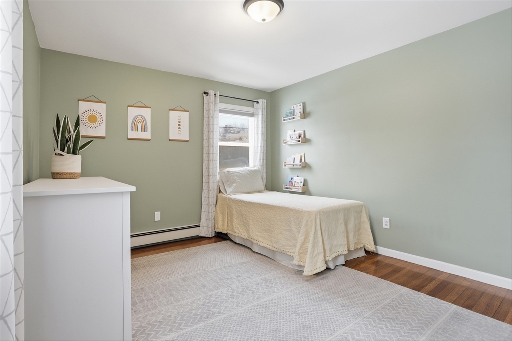 37 Sterling Street Lancaster, MA 01523 - Photo 19 of 33 a spacious bedroom with a bed and a window