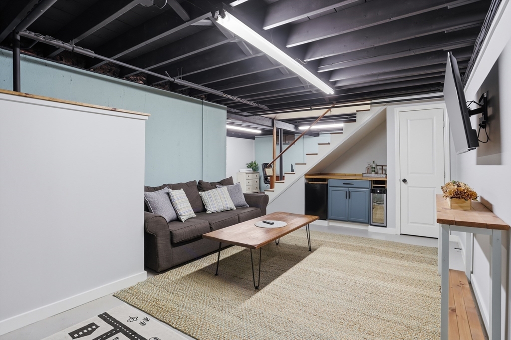 37 Sterling Street Lancaster, MA 01523 - Photo 21 of 33 a living room with furniture and a wooden floor