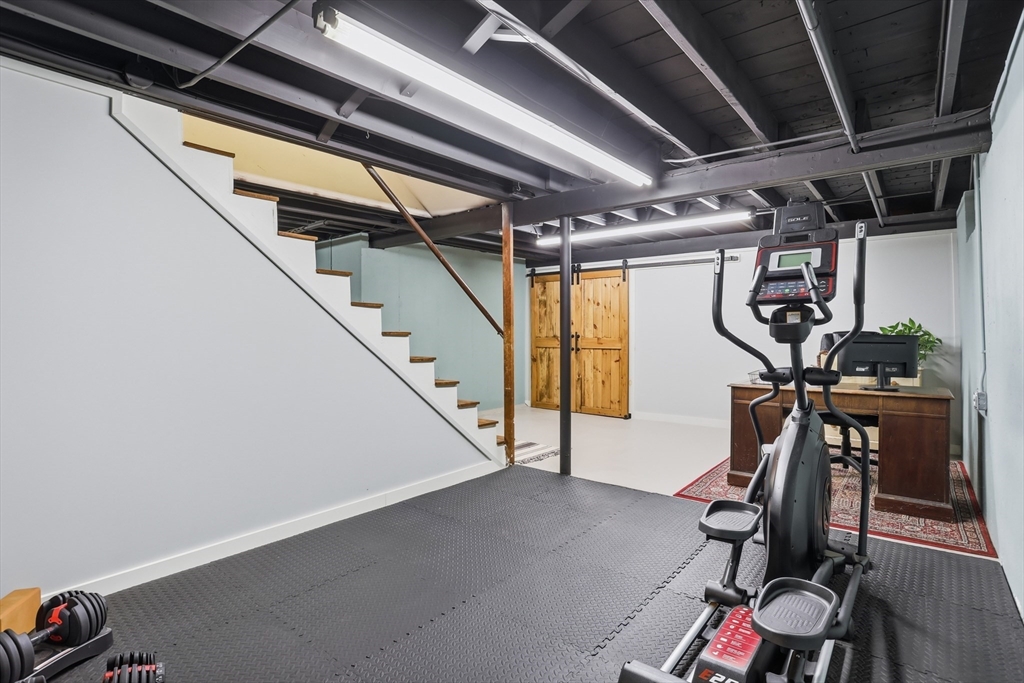 37 Sterling Street Lancaster, MA 01523 - Photo 22 of 33 a view of an empty room with gym equipment
