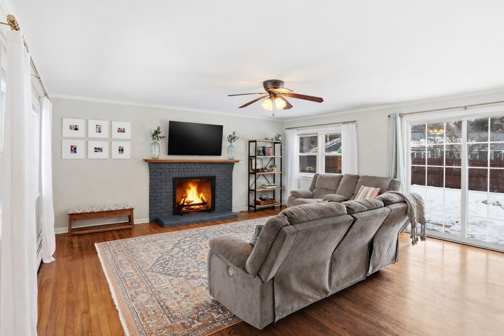 37 Sterling Street Lancaster, MA 01523 - Photo 4 of 33 a bed room with a bed and a fireplace