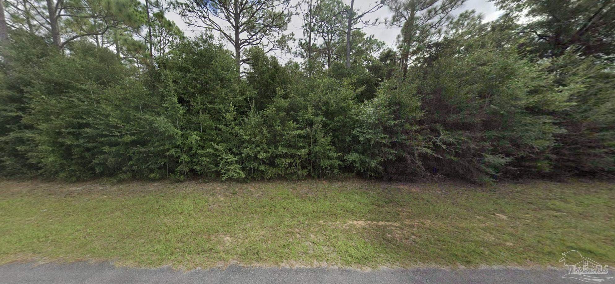 6512 Tracker Drive Milton, FL 32583 - Photo 13 of 18 a view of a green field
