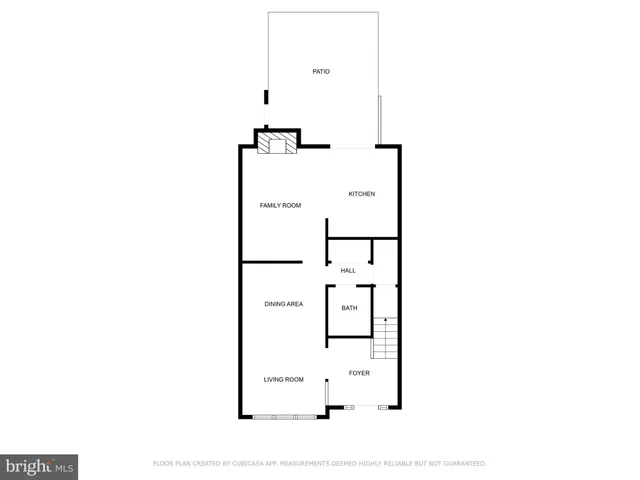 a picture of a bench in front of a wall