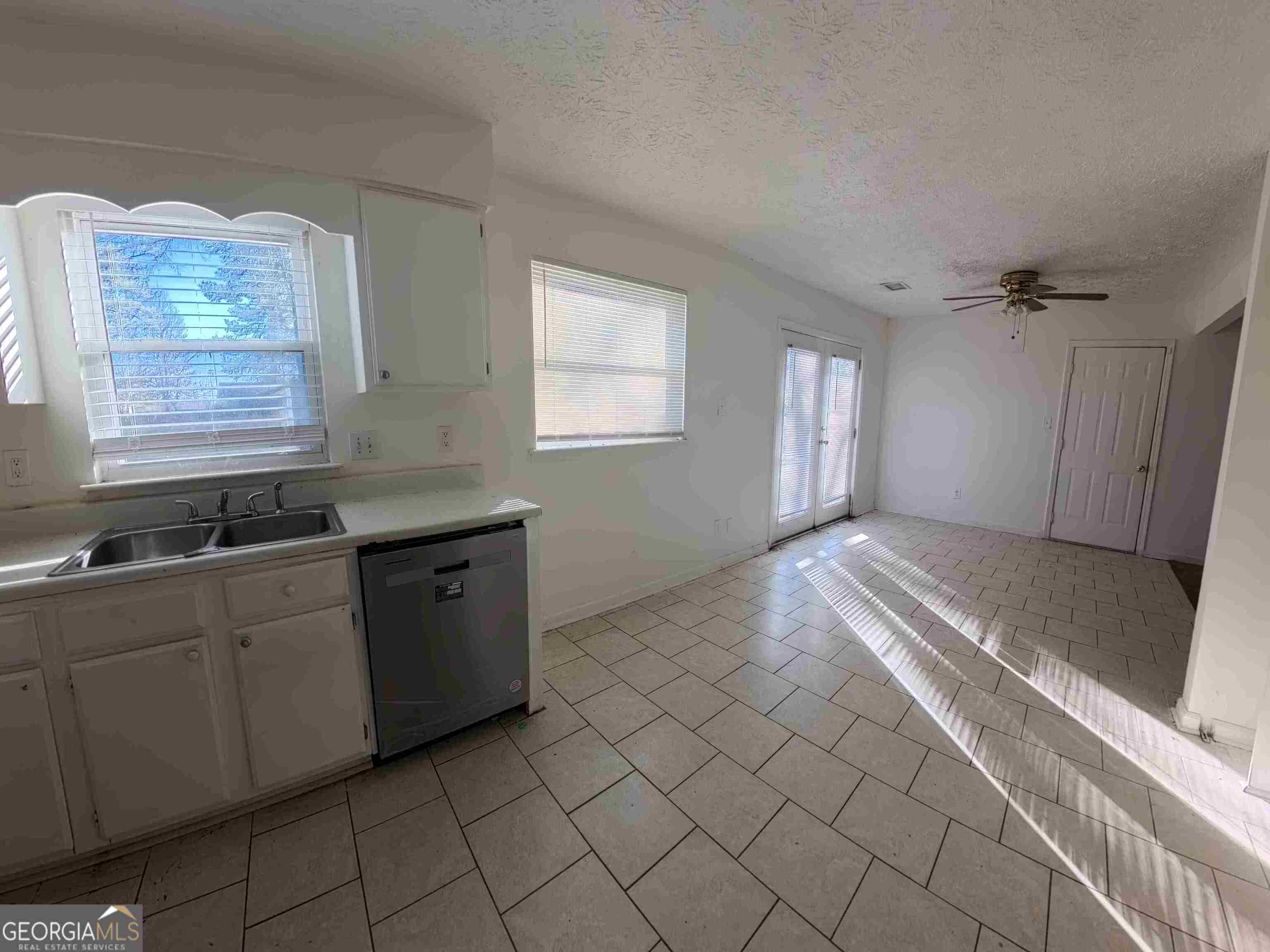 11187 Shannon Circle Hampton, GA 30228 - Photo 11 of 22 a kitchen with stainless steel appliances granite countertop a sink and a granite counter tops
