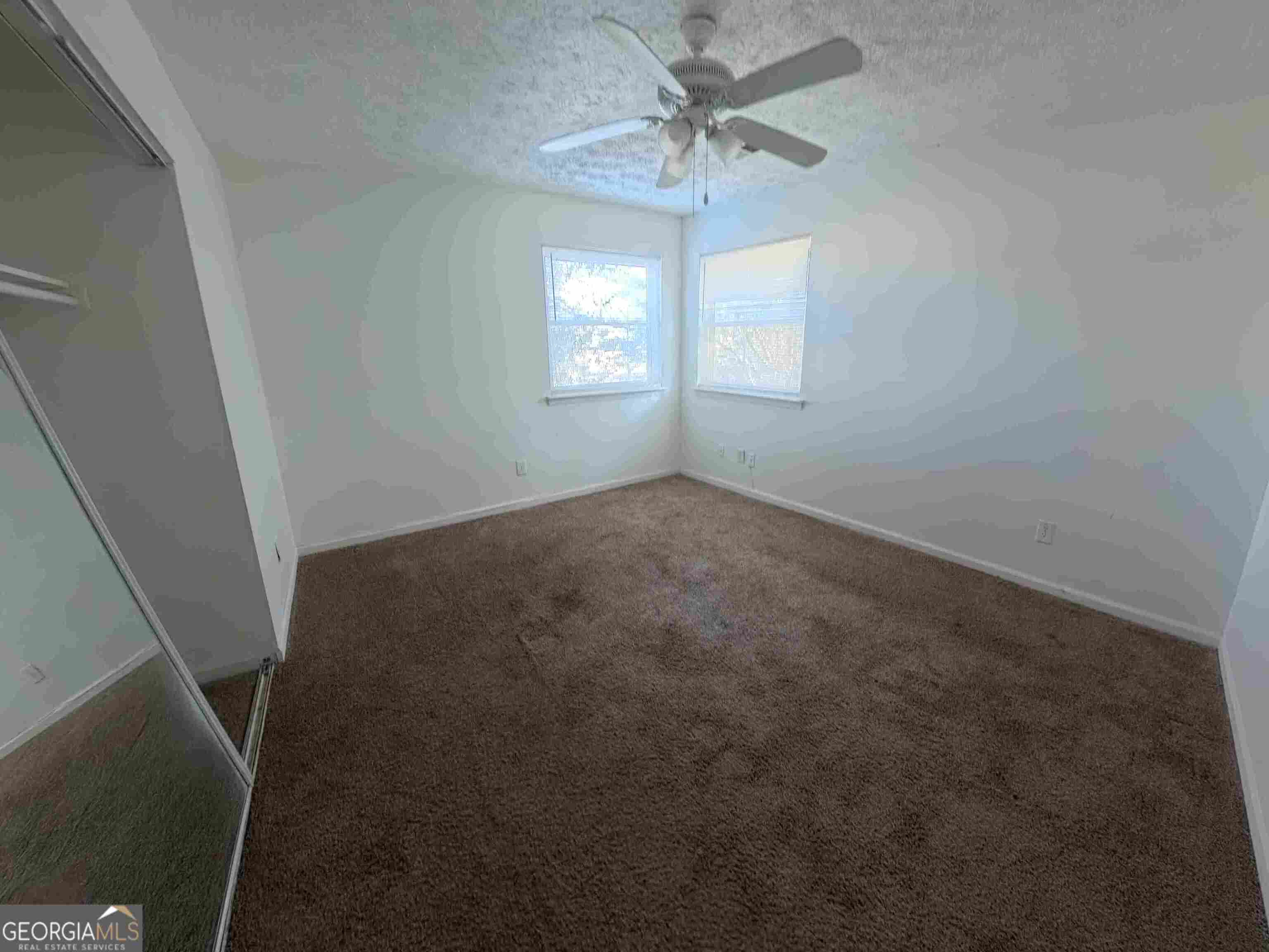 11187 Shannon Circle Hampton, GA 30228 - Photo 14 of 22 a view of an empty room with a window