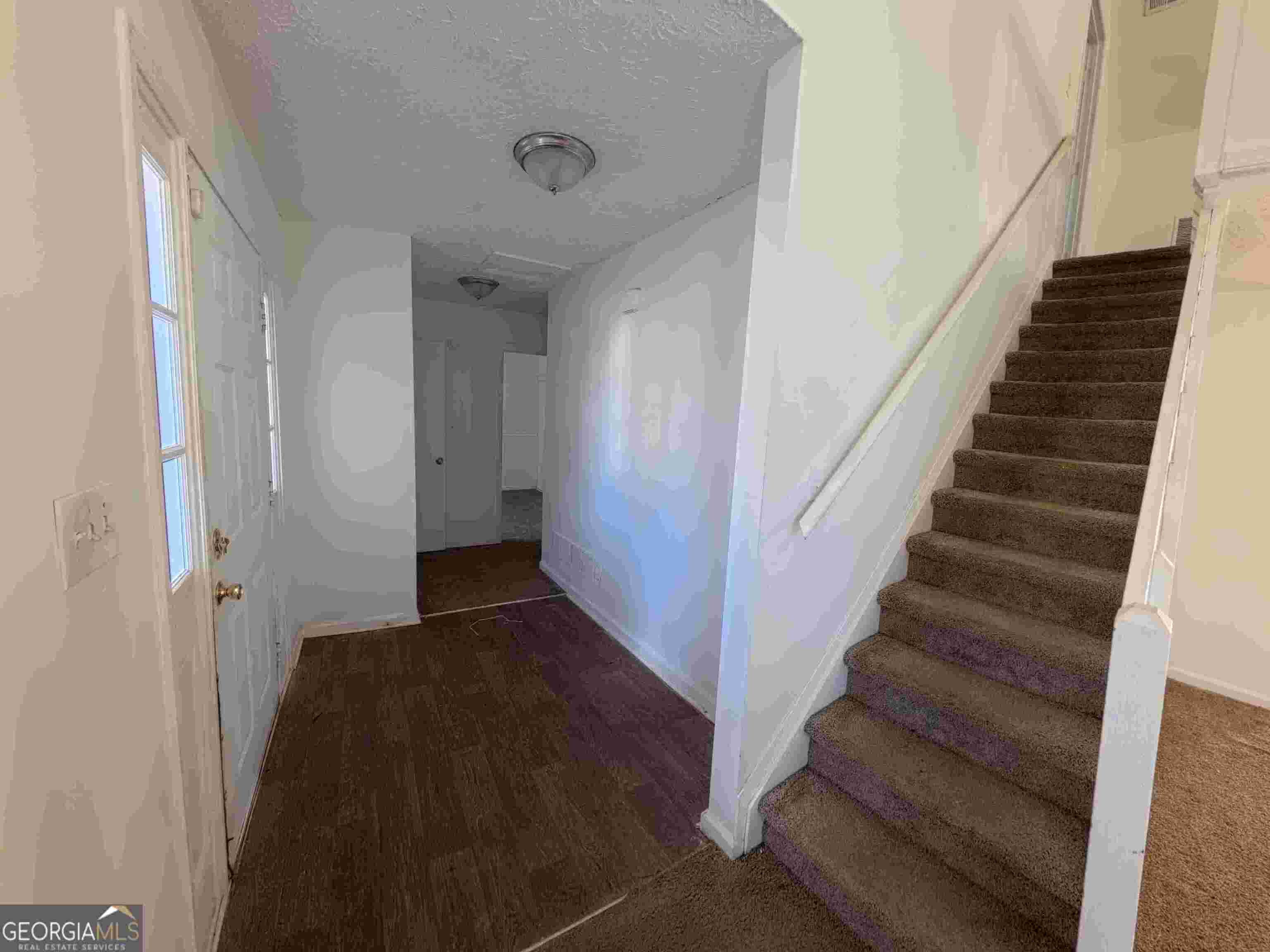 11187 Shannon Circle Hampton, GA 30228 - Photo 19 of 22 a view of entryway with stairs