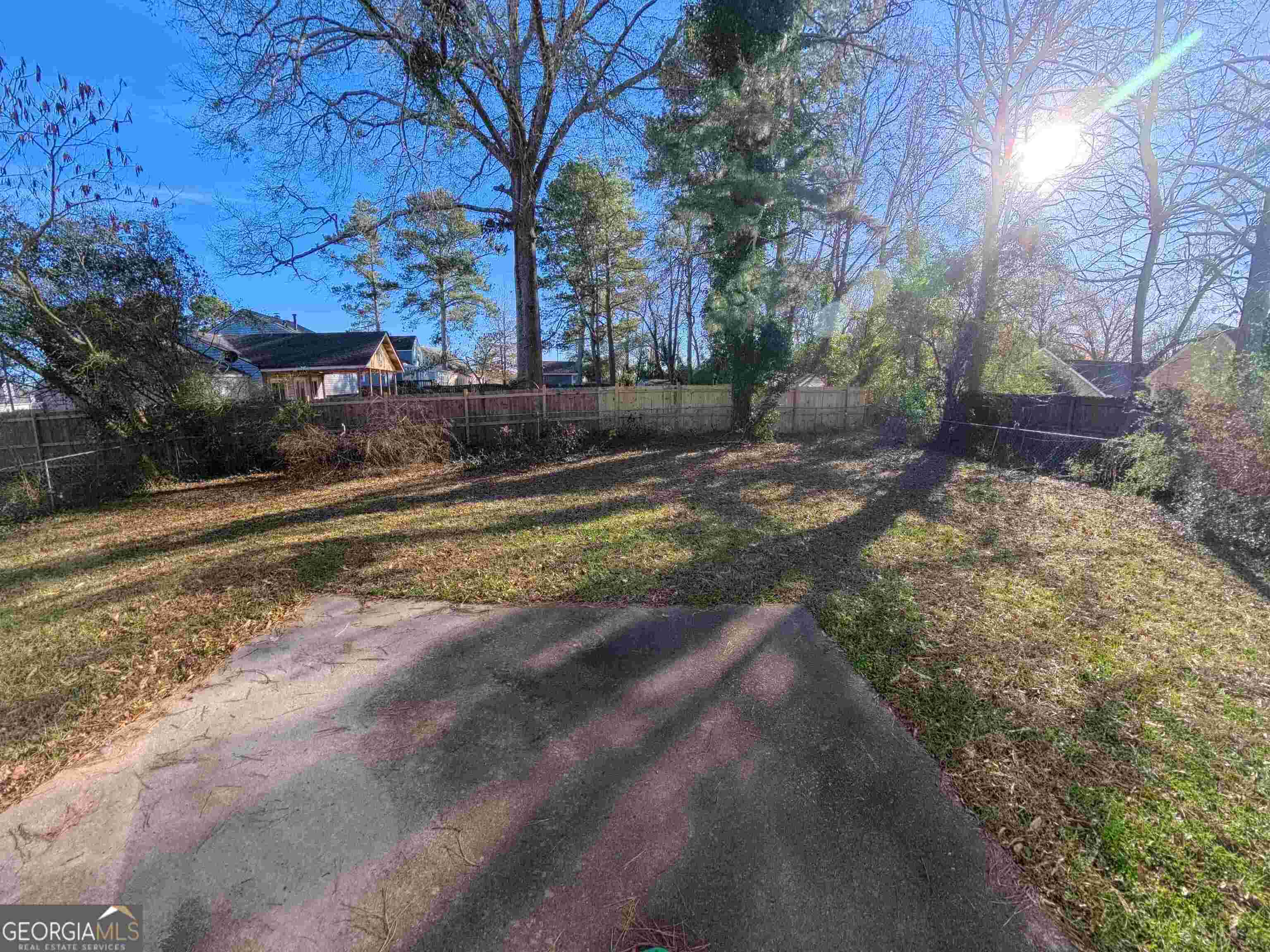 11187 Shannon Circle Hampton, GA 30228 - Photo 7 of 22 a view of a yard with a tree