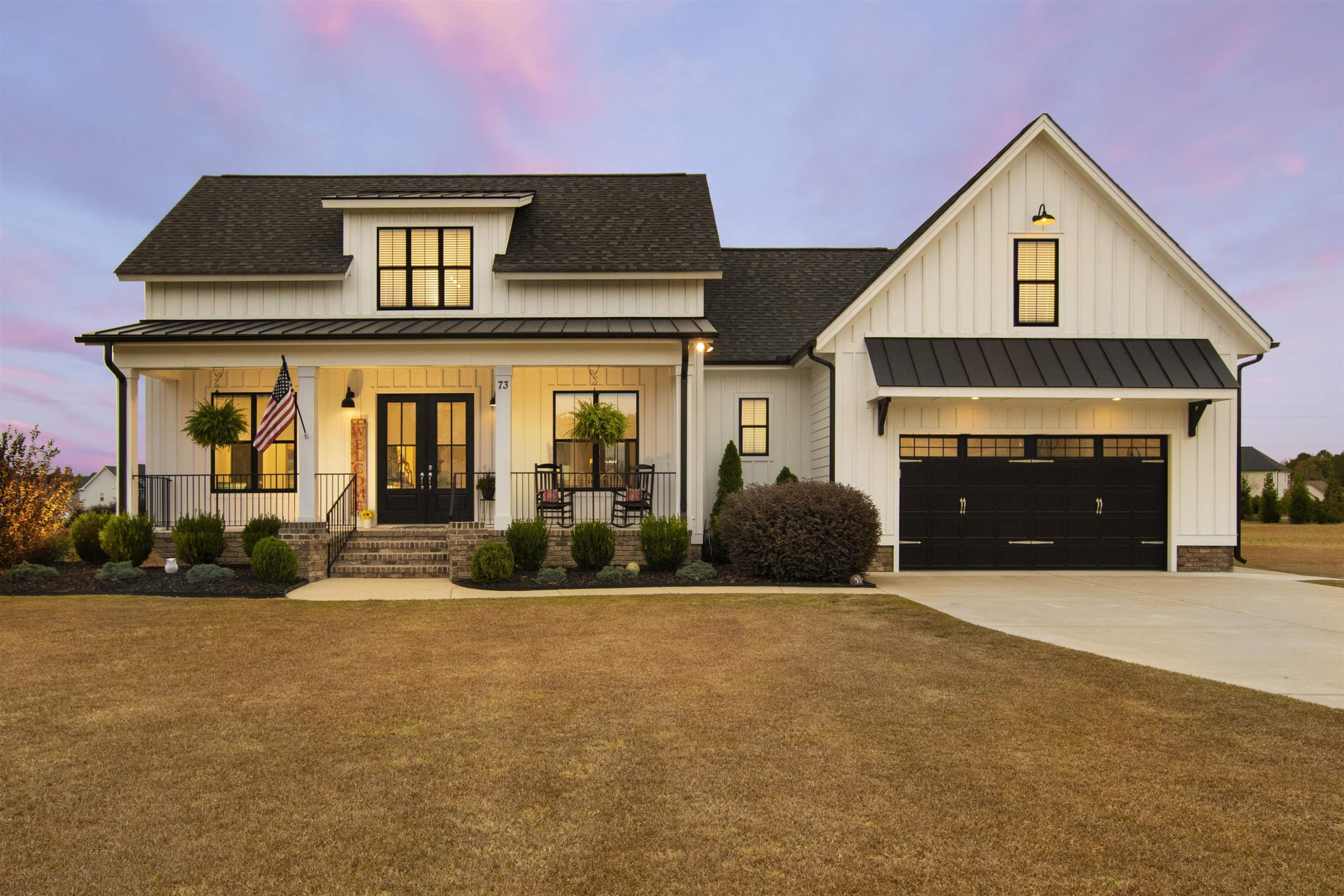 a front view of a house with a yard