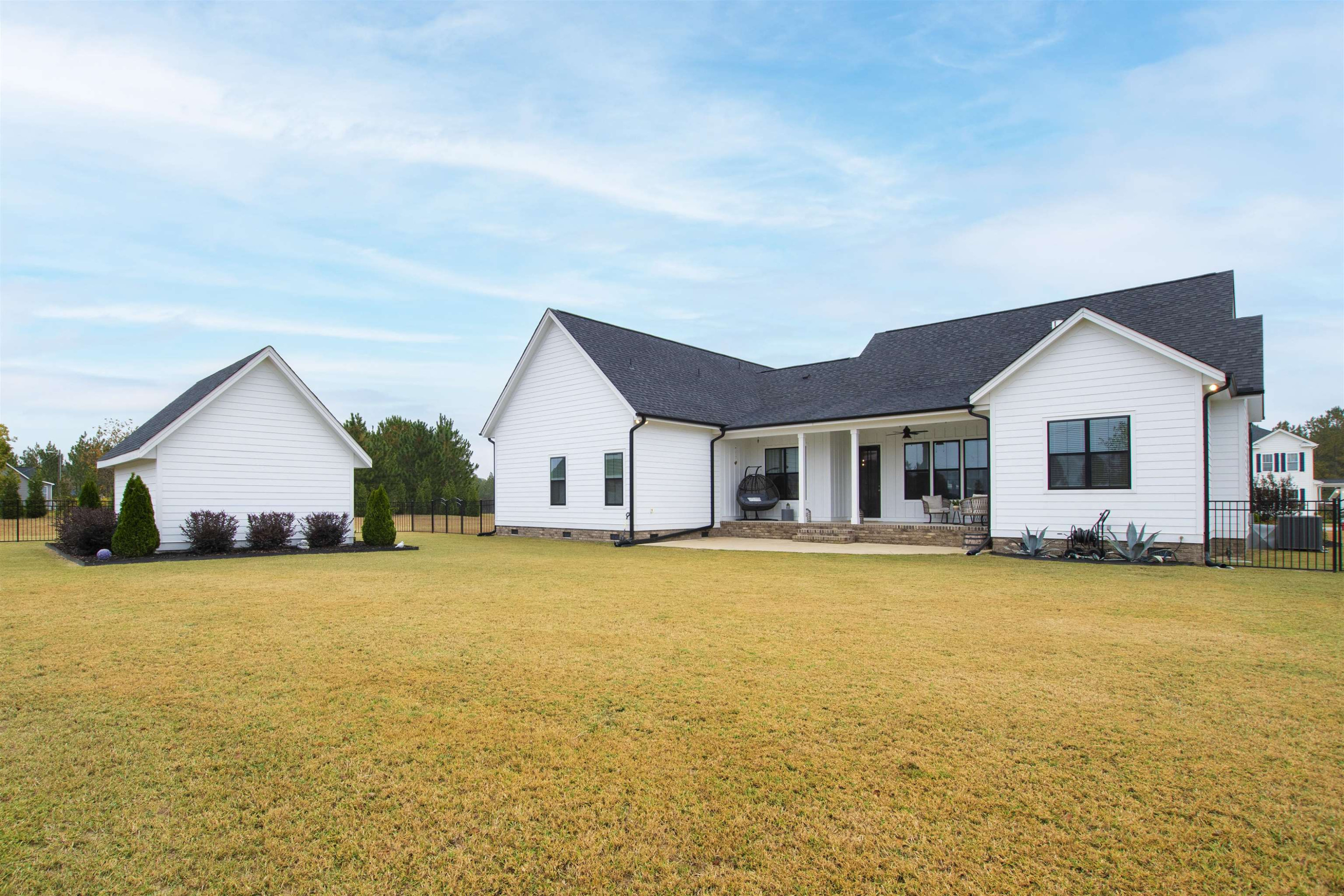 73 Constitution Avenue Smithfield, NC 27577 - Photo 11 of 66 a view of a house with swimming pool and a yard