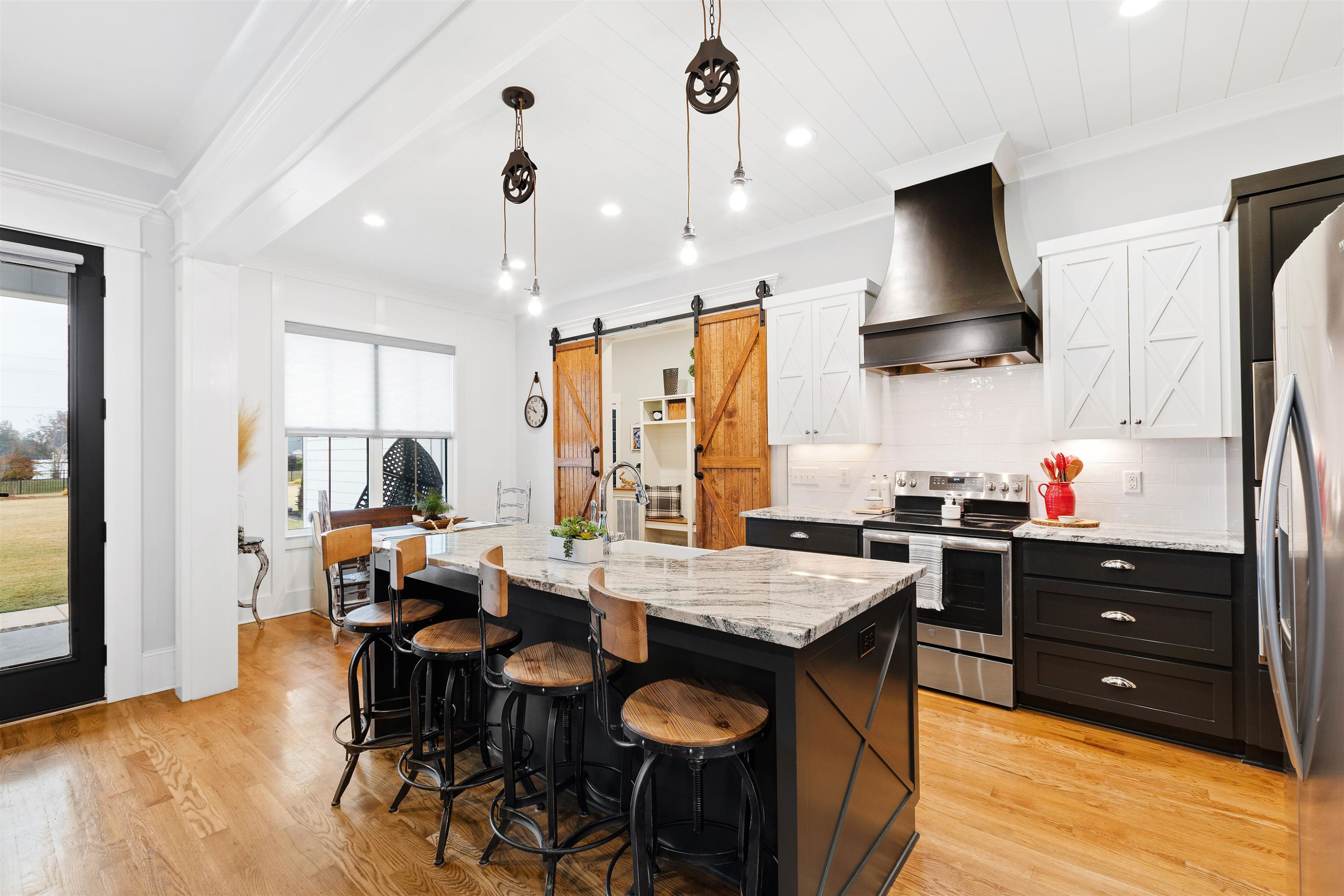73 Constitution Avenue Smithfield, NC 27577 - Photo 26 of 66 a kitchen with granite countertop a table chairs sink and wooden floor