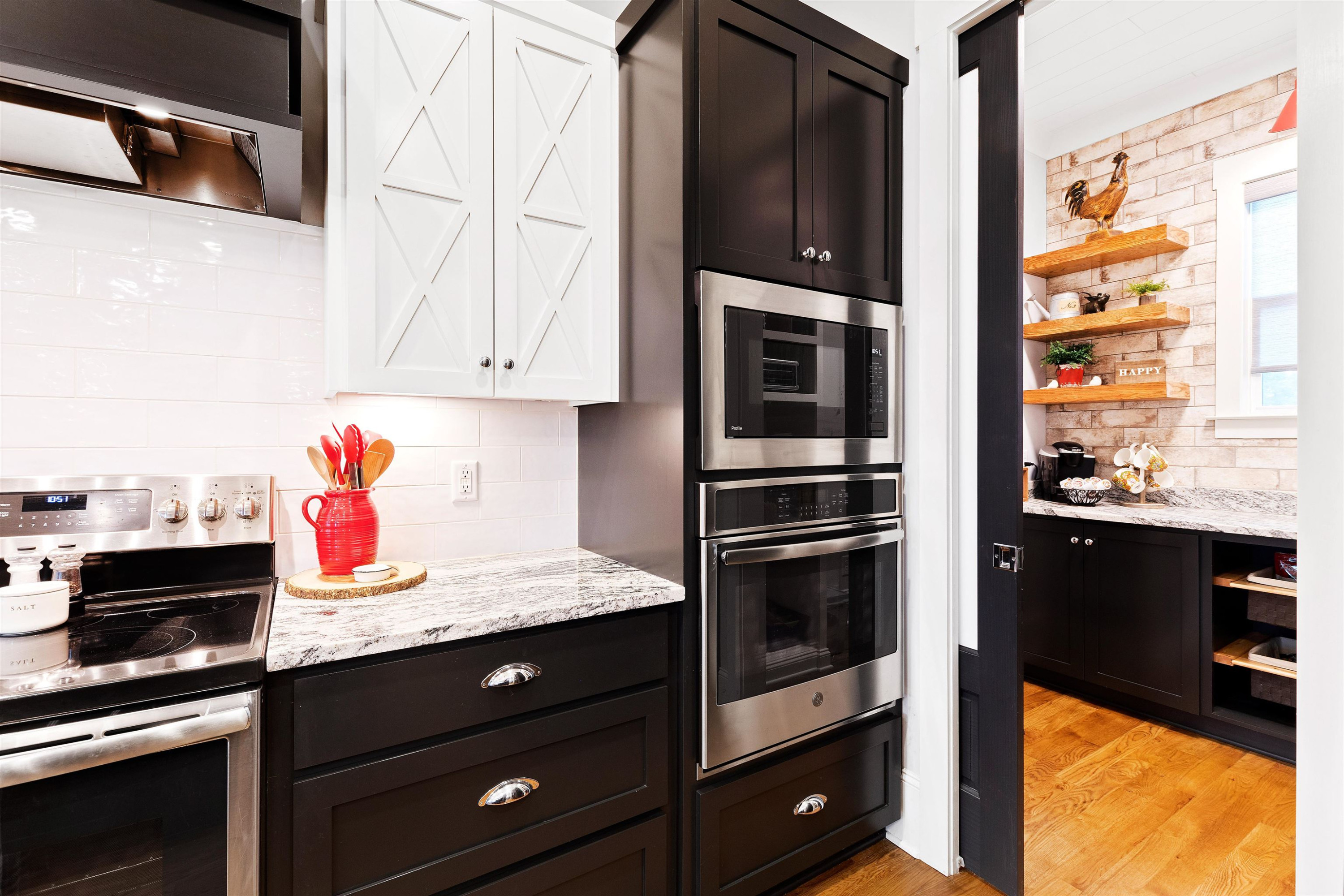 73 Constitution Avenue Smithfield, NC 27577 - Photo 27 of 66 a kitchen with stainless steel appliances kitchen island granite countertop a stove microwave and cabinets
