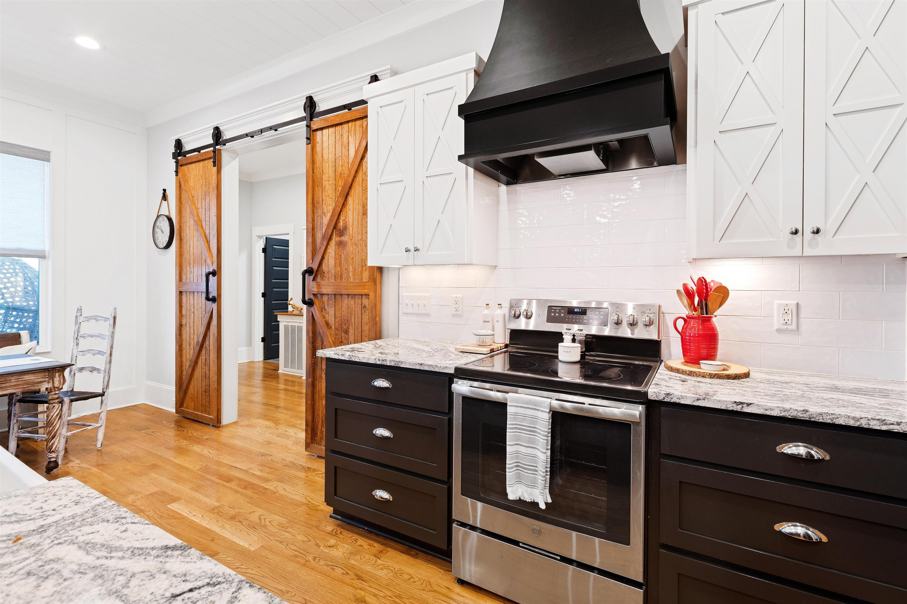73 Constitution Avenue Smithfield, NC 27577 - Photo 30 of 66 a kitchen with stainless steel appliances granite countertop a sink stove and refrigerator