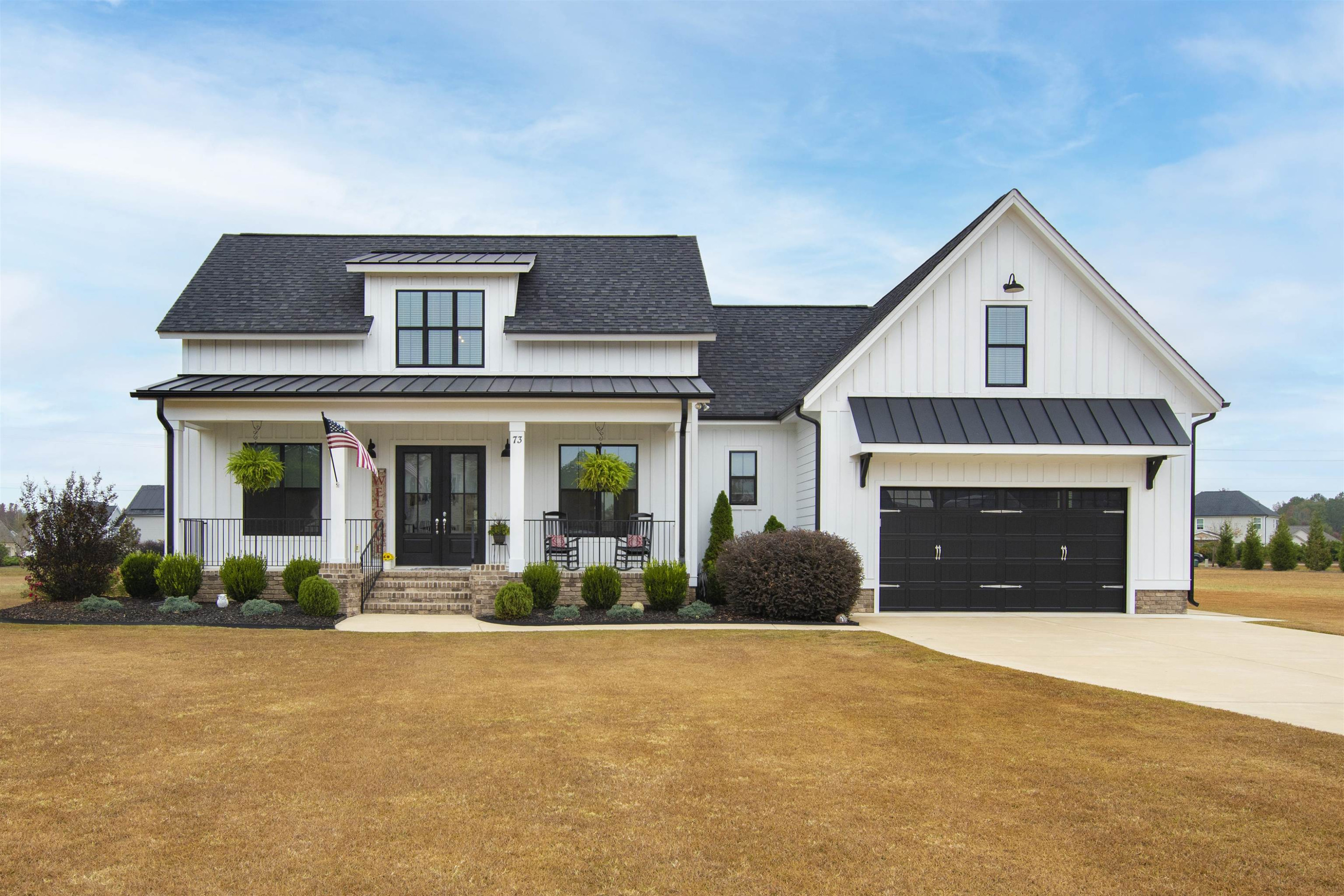 73 Constitution Avenue Smithfield, NC 27577 - Photo 3 of 66 a front view of a house with garden