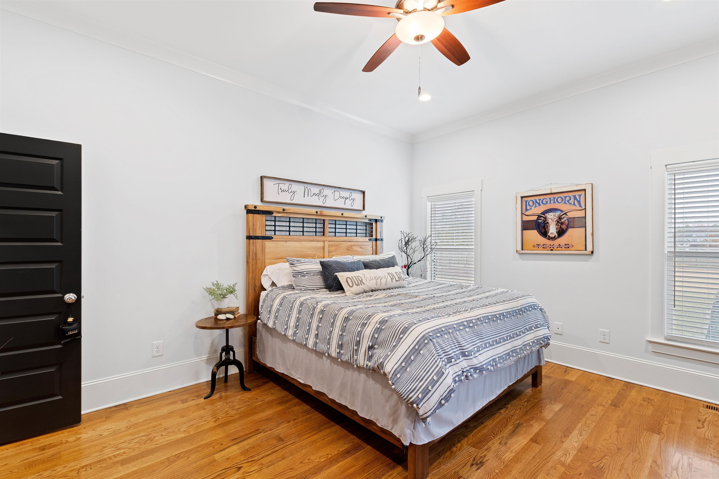 73 Constitution Avenue Smithfield, NC 27577 - Photo 35 of 66 a bedroom with a bed and wooden floor