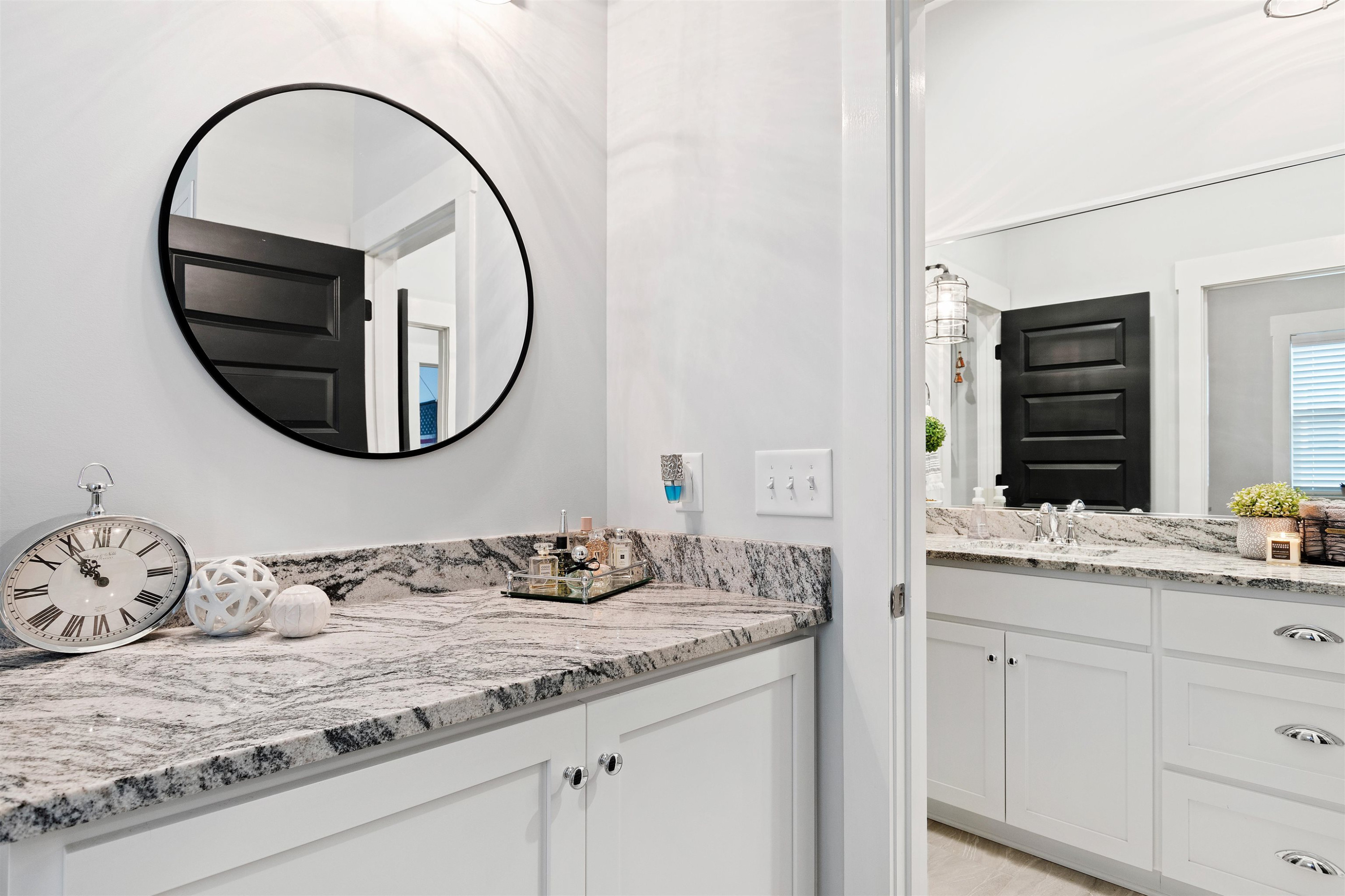 73 Constitution Avenue Smithfield, NC 27577 - Photo 39 of 66 a bathroom with a granite countertop sink and a mirror