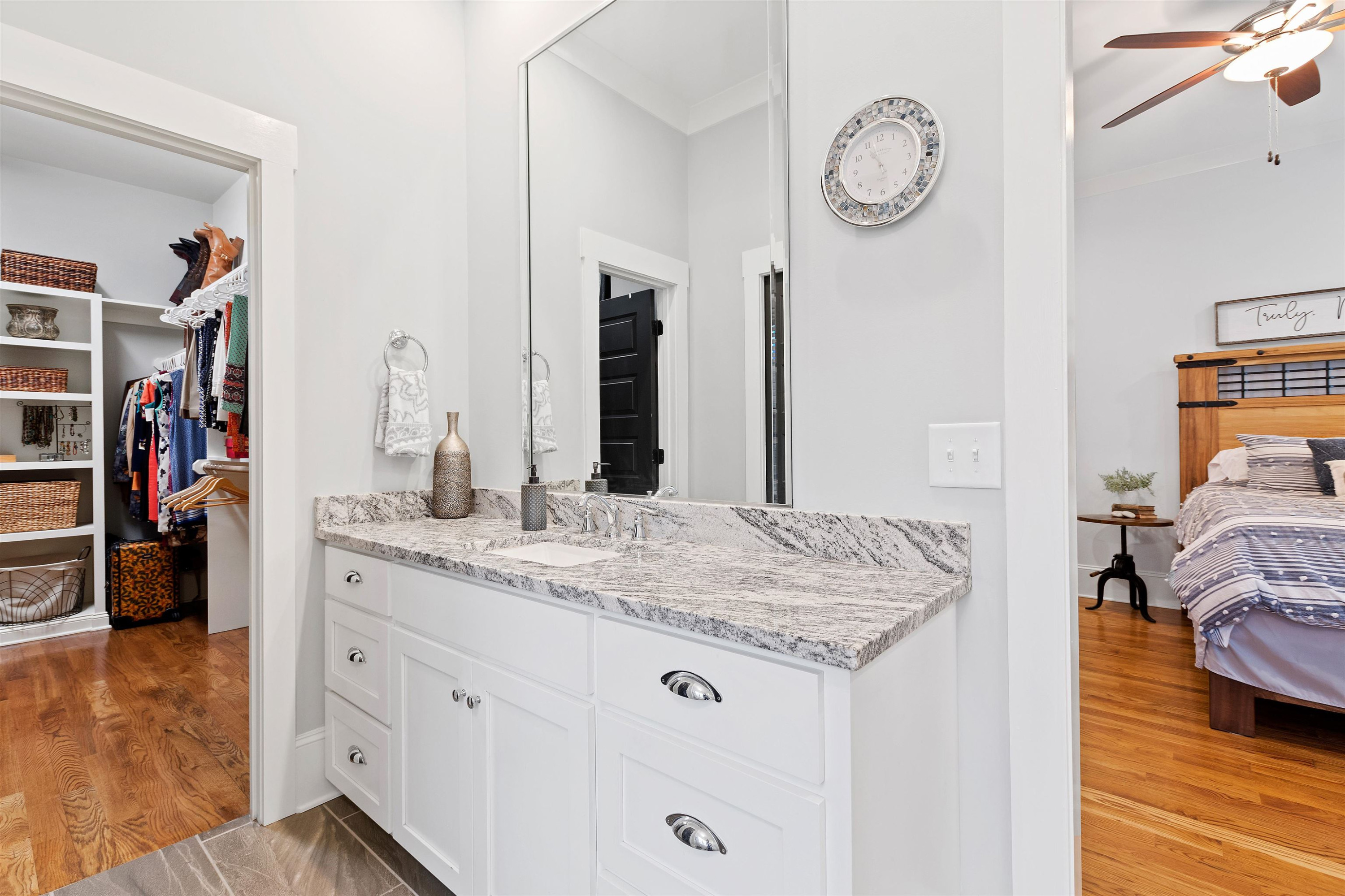 73 Constitution Avenue Smithfield, NC 27577 - Photo 41 of 66 a en suite bathroom with a granite countertop sink and a mirror