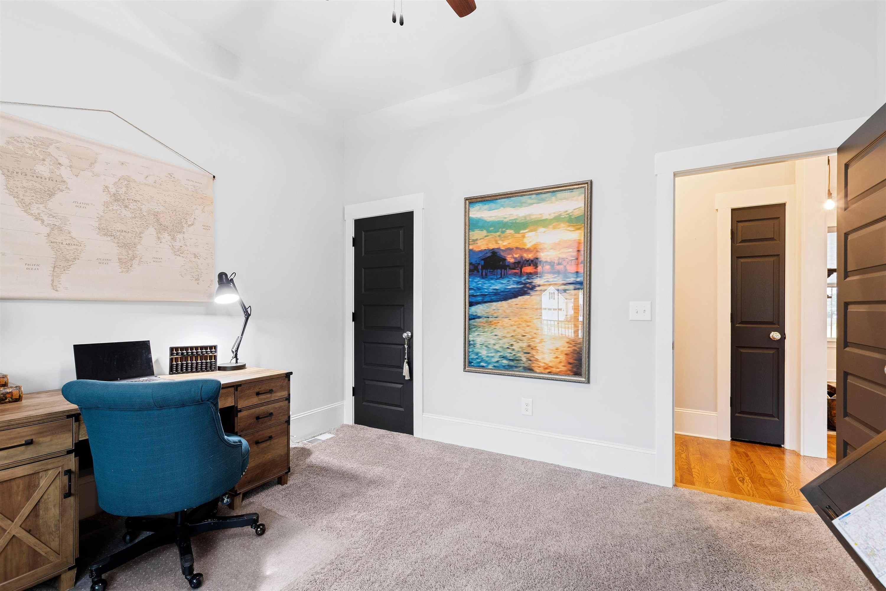 73 Constitution Avenue Smithfield, NC 27577 - Photo 44 of 66 a view of a workspace with furniture and a window