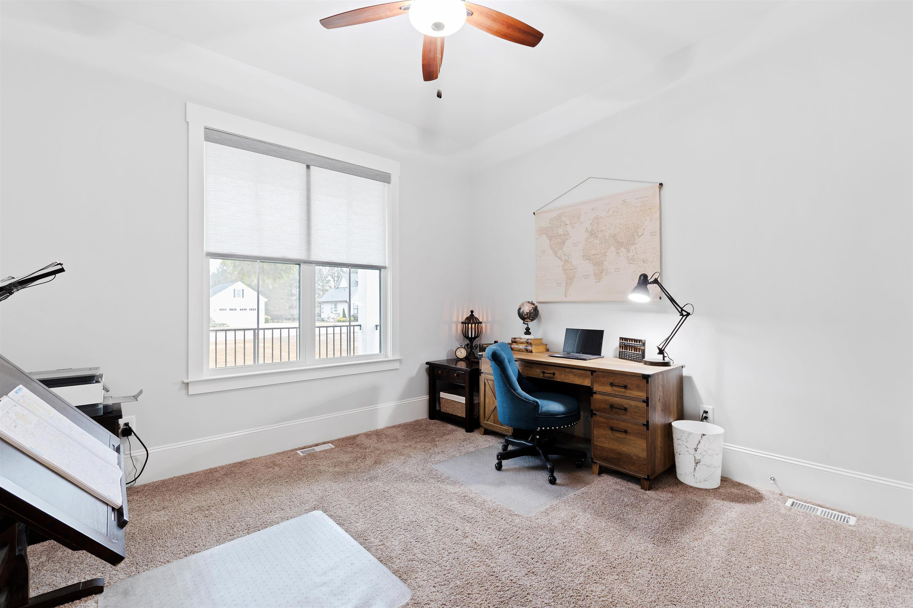 73 Constitution Avenue Smithfield, NC 27577 - Photo 45 of 66 a view of a workspace with furniture and a window