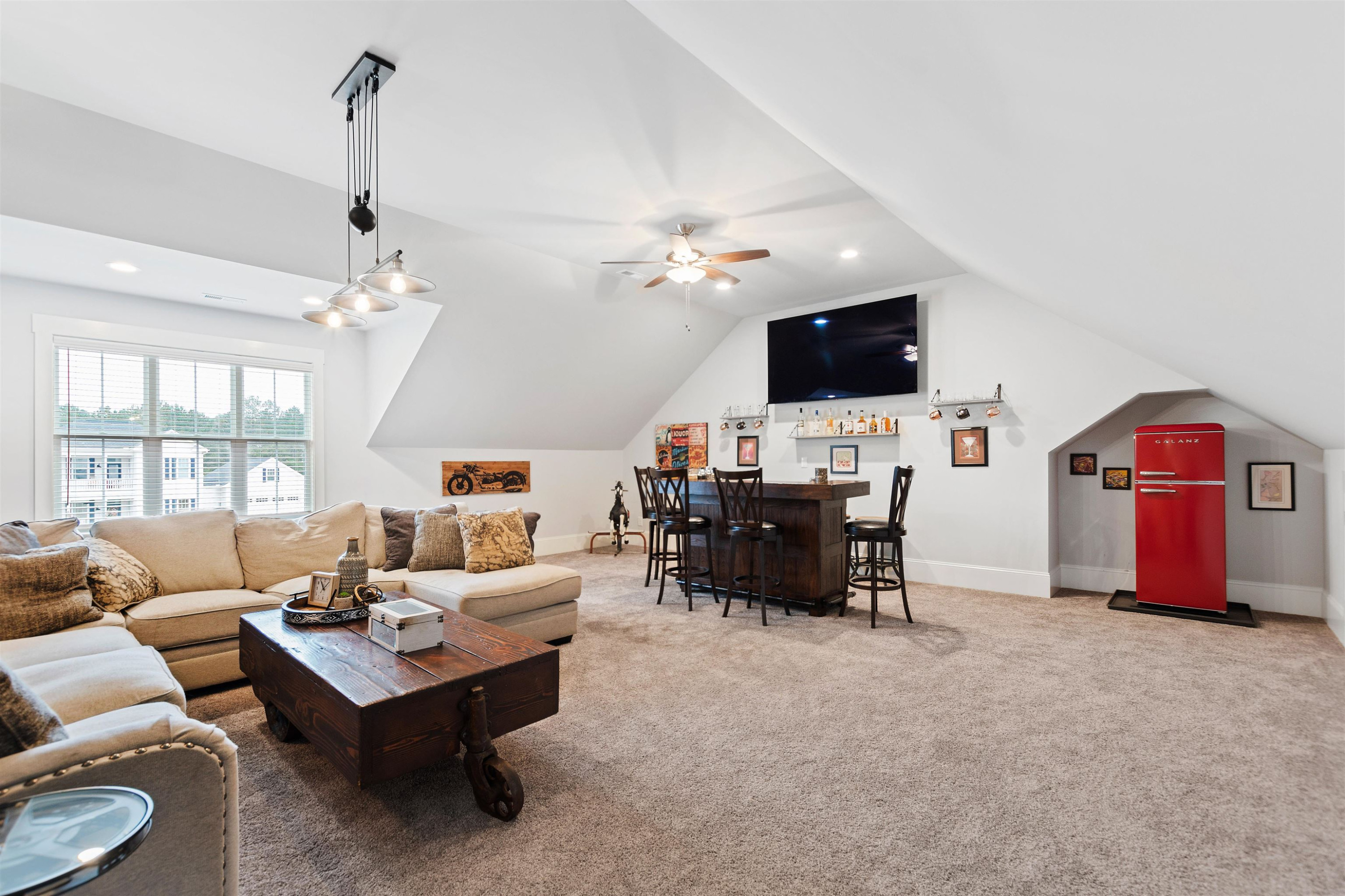 73 Constitution Avenue Smithfield, NC 27577 - Photo 54 of 66 a living room with furniture and a flat screen tv