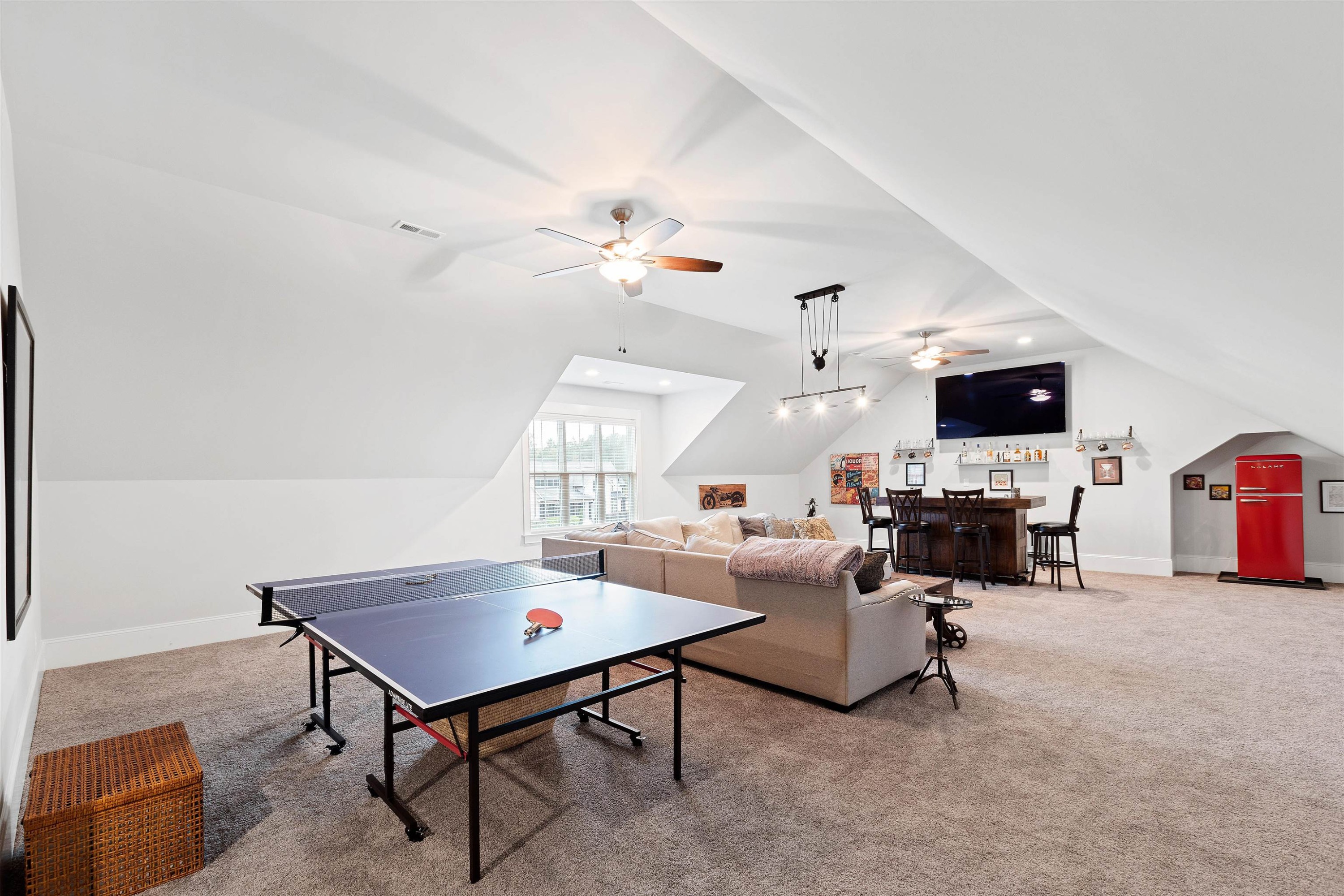 73 Constitution Avenue Smithfield, NC 27577 - Photo 57 of 66 a living room with furniture and a flat screen tv