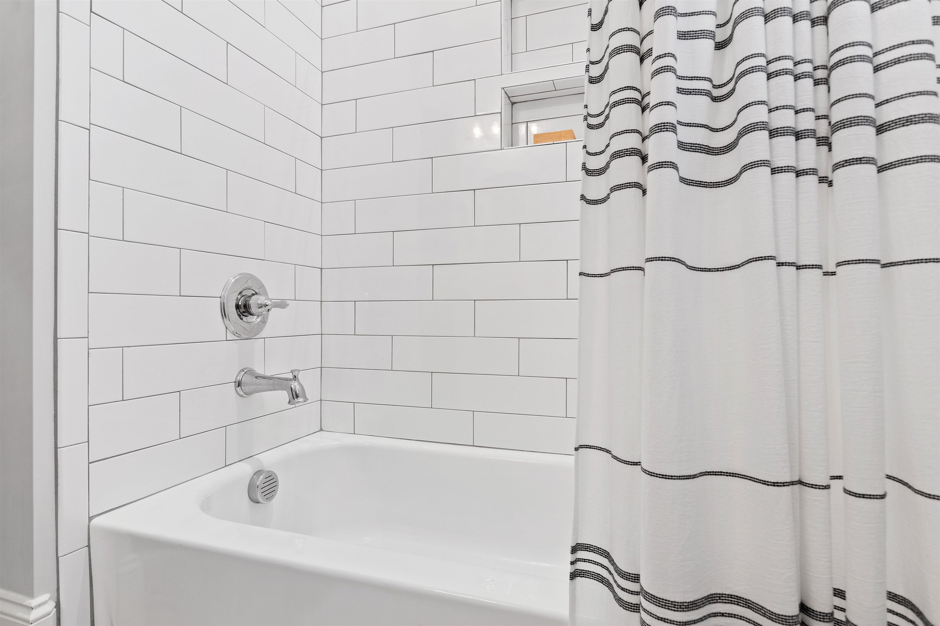 73 Constitution Avenue Smithfield, NC 27577 - Photo 62 of 66 a bathroom with a bathtub and shower