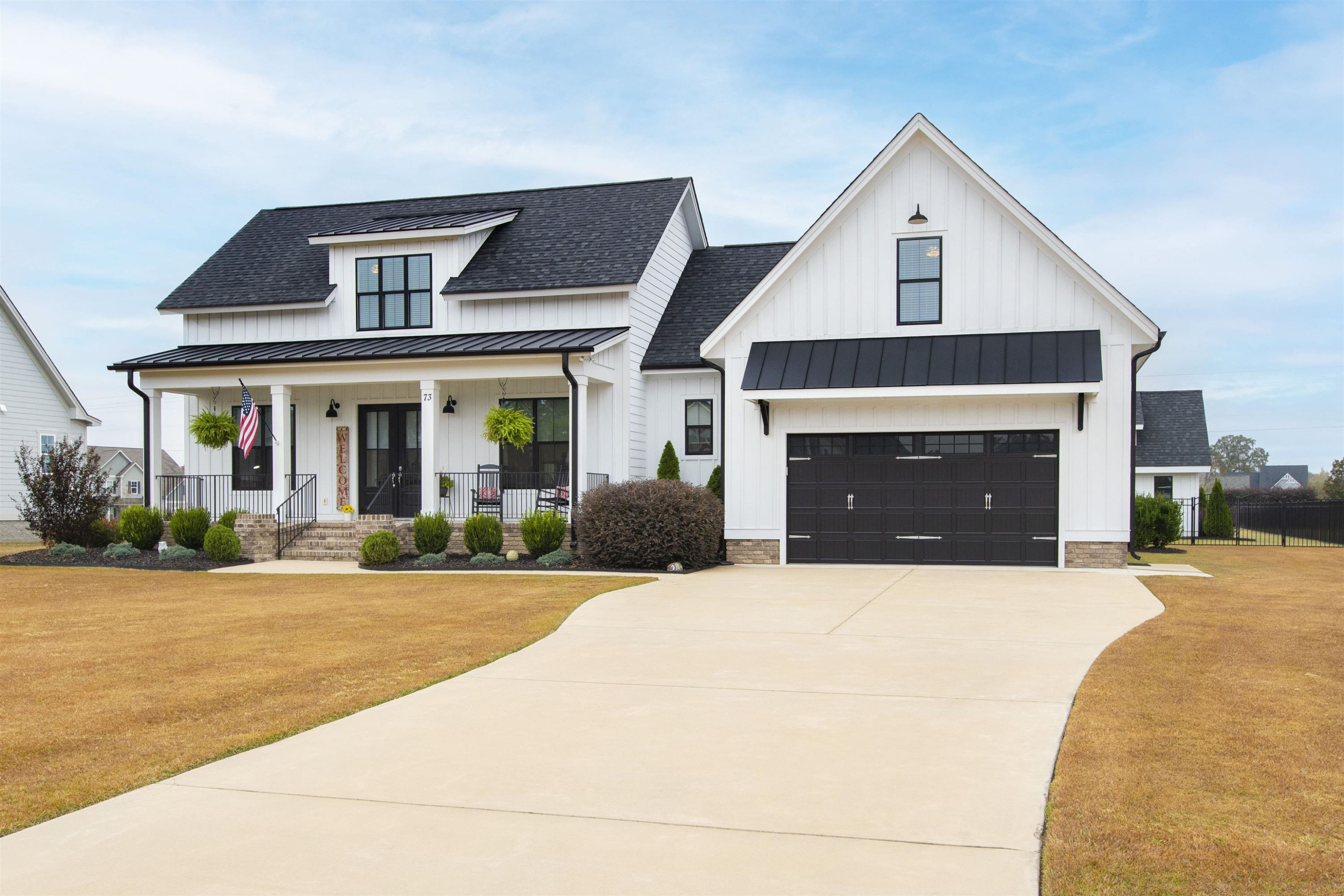 73 Constitution Avenue Smithfield, NC 27577 - Photo 63 of 66 a front view of a house with yard and parking