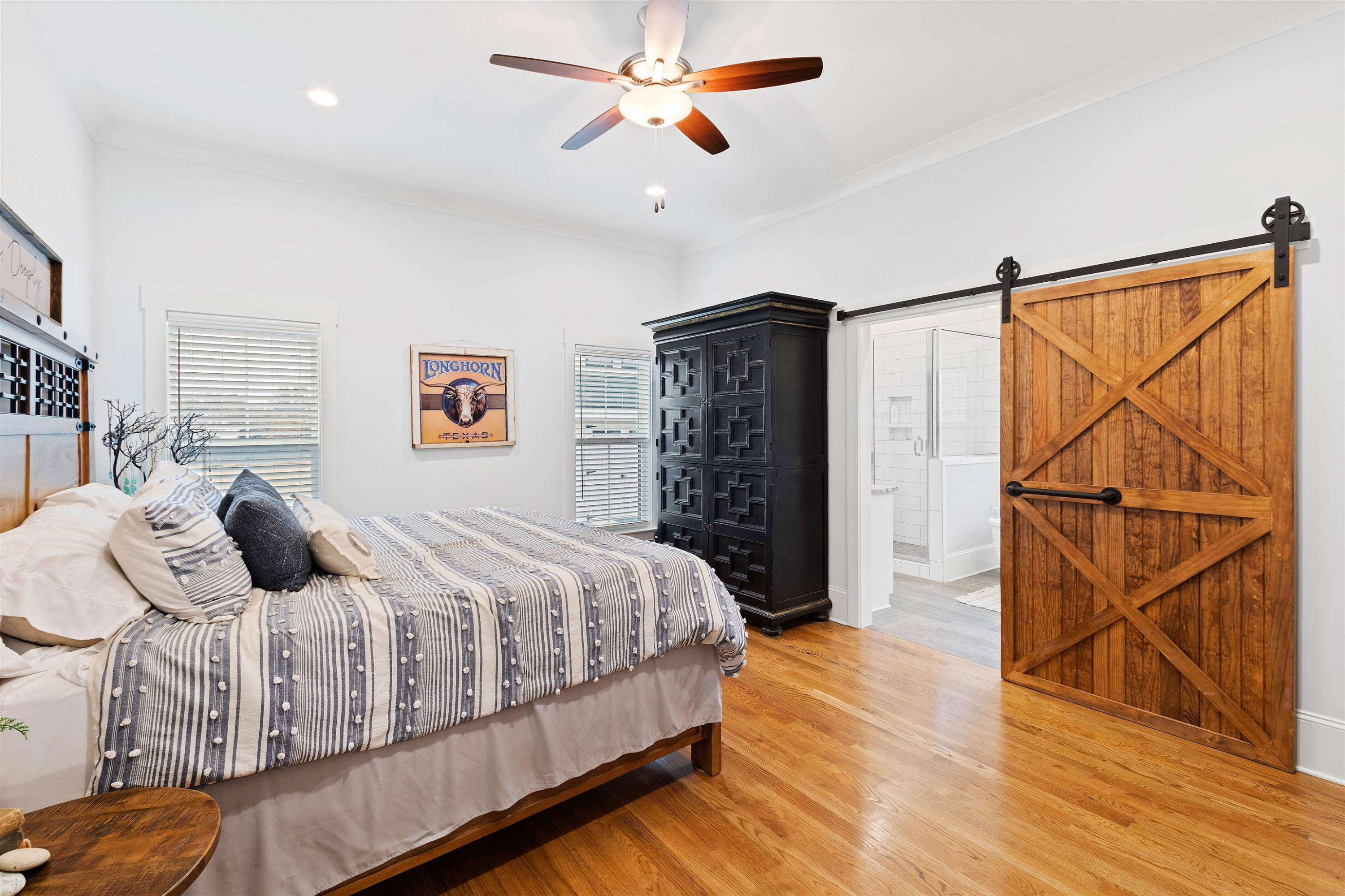 73 Constitution Avenue Smithfield, NC 27577 - Photo 8 of 66 a bedroom with a bed and wooden floor