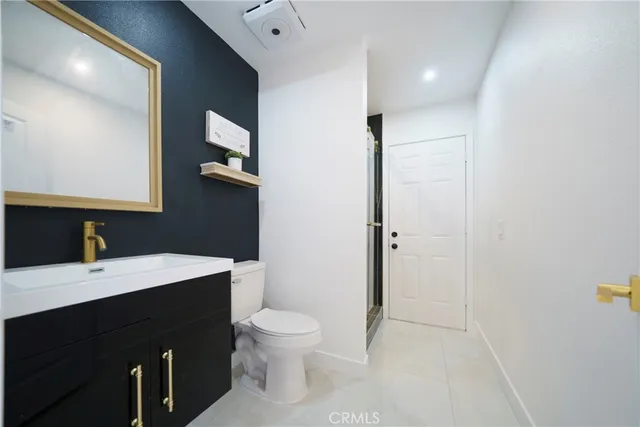 a spacious bathroom with a tub sink and mirror