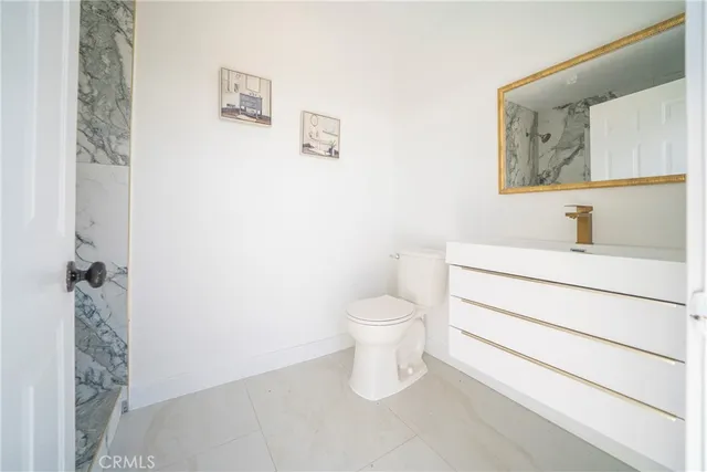 a view of a work space with furniture and wooden floor